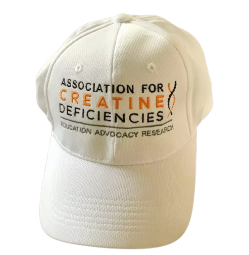 white hat with blue lettering that says Association for Creatine Deficiencies, Education Advocacy, Research
